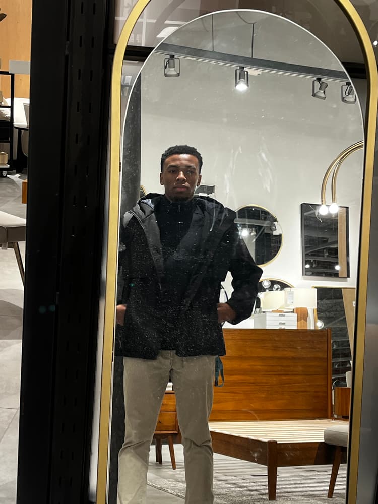 Chiedozie Ehileme takes a photo in a store